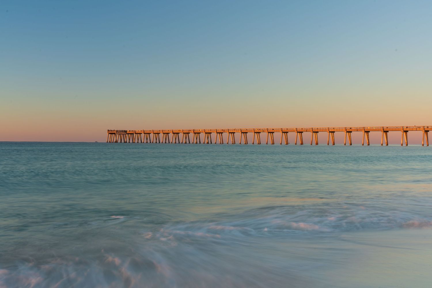Golden hour at Navarre Beach Pier. Long exposure, fine art landscape photo.