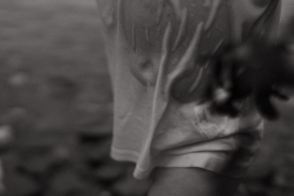 Artistic blurred close-up of flowing white fabric in motion.