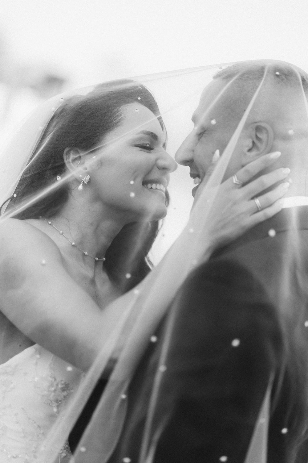Black and white sequence of joyful moments shared between two people during a romantic celebration.