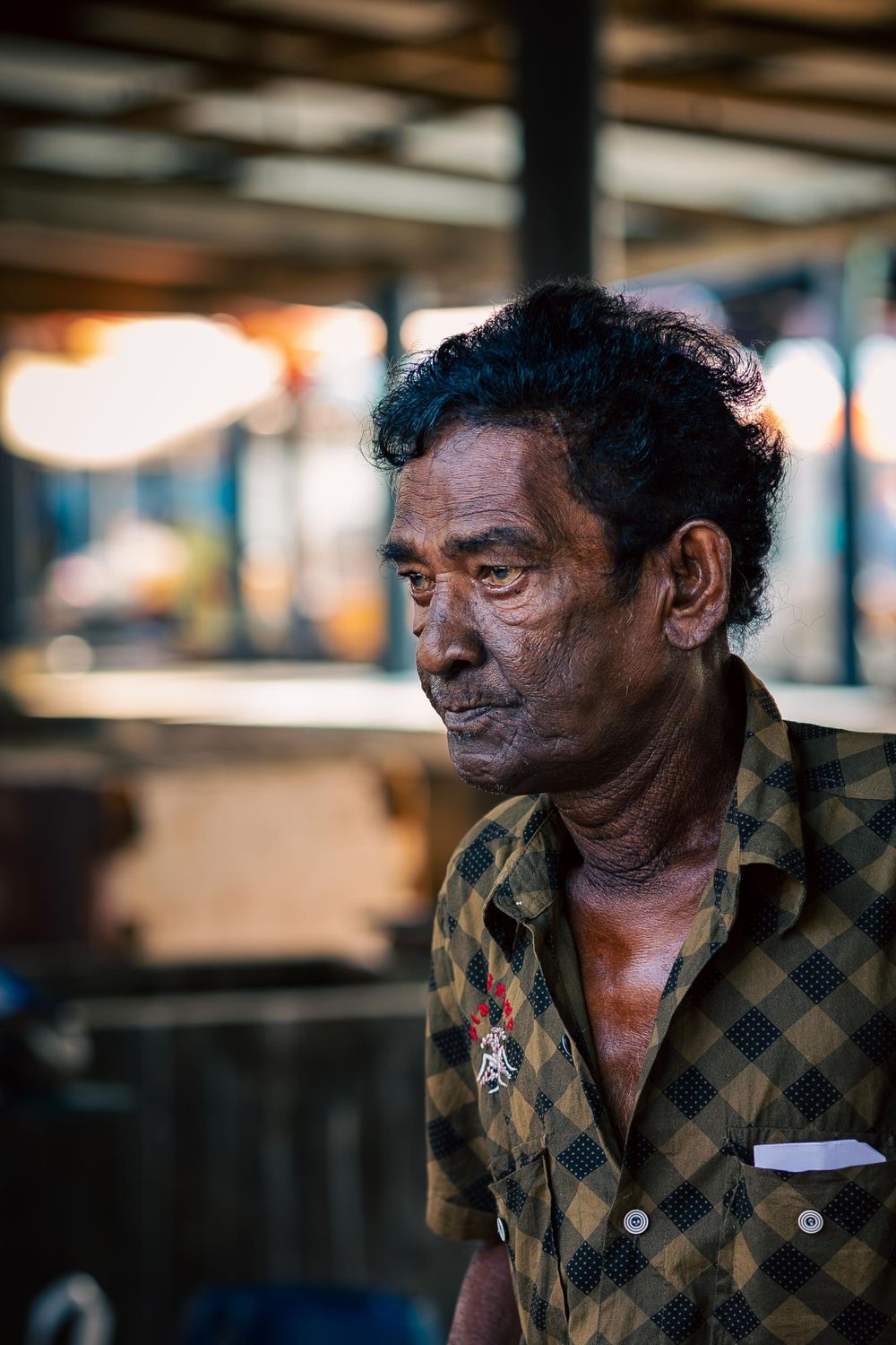 Portrait of a fisherman selling his catch at the fist market in Sri Lanka.