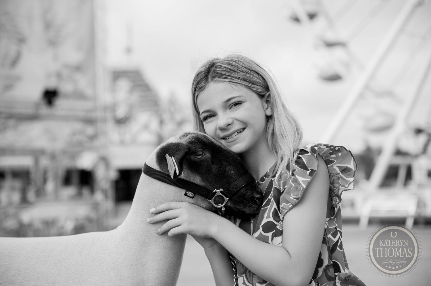 Black and white portrait of affectionate moment between show animal and handler at county fair.