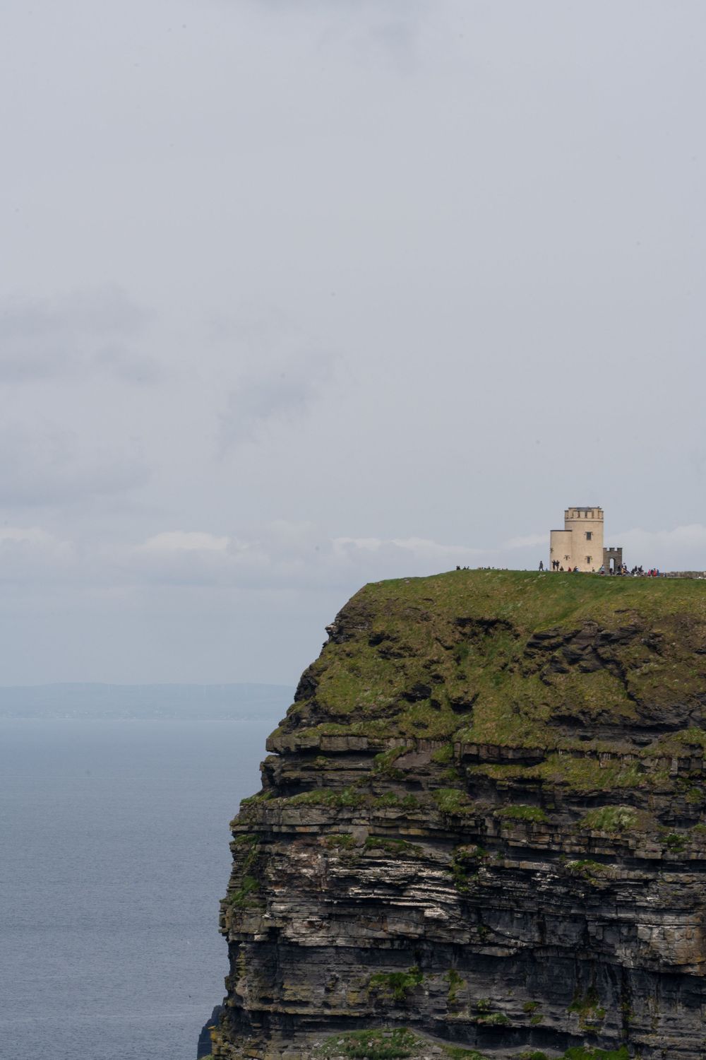 O'Brien's Tower perches atop the dramatic layered cliffs overlooking the Irish Sea.