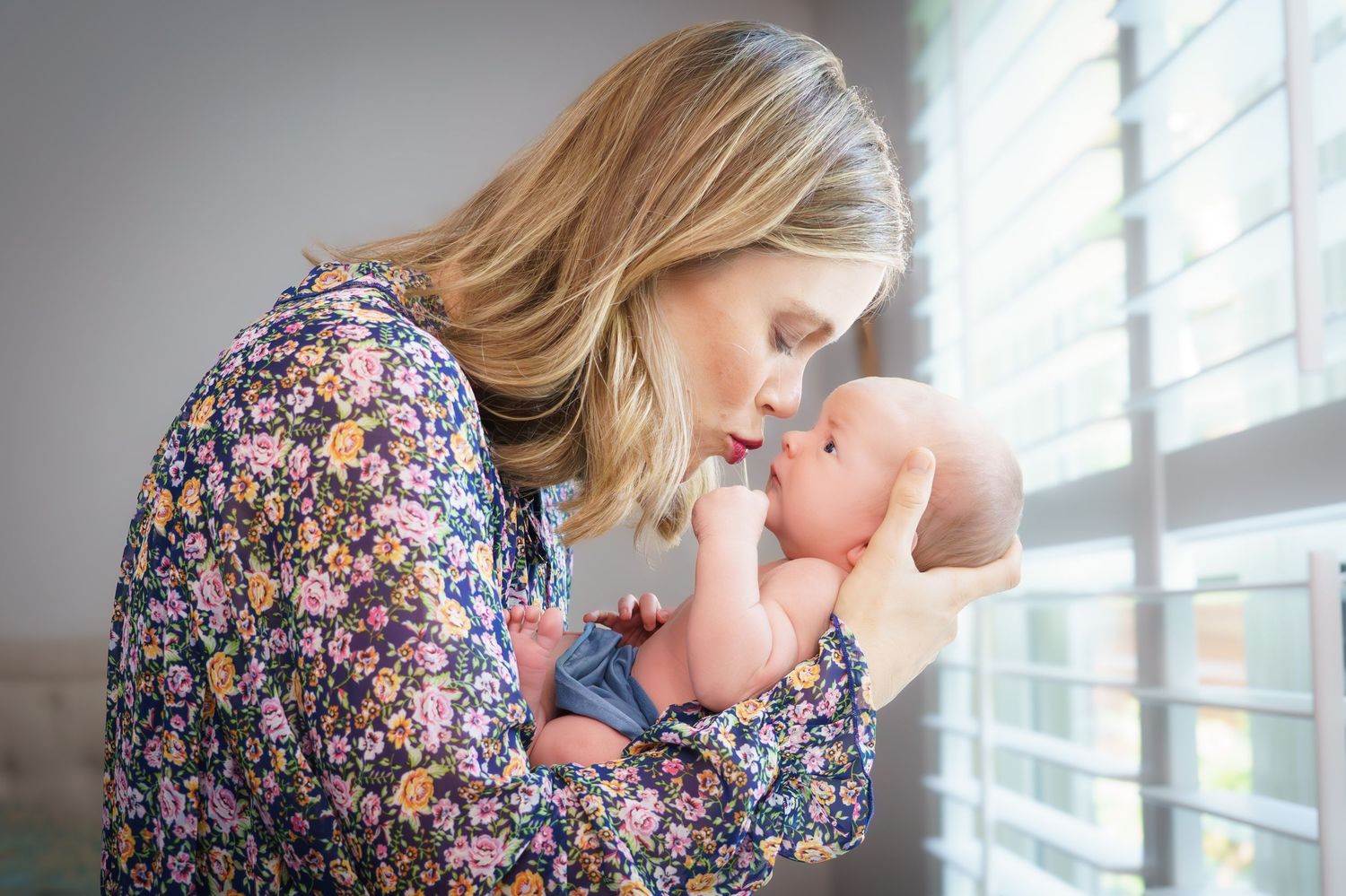 newborn family photo session at home siblings cozy natural light  baby boy  big sister big brother blue at home studio