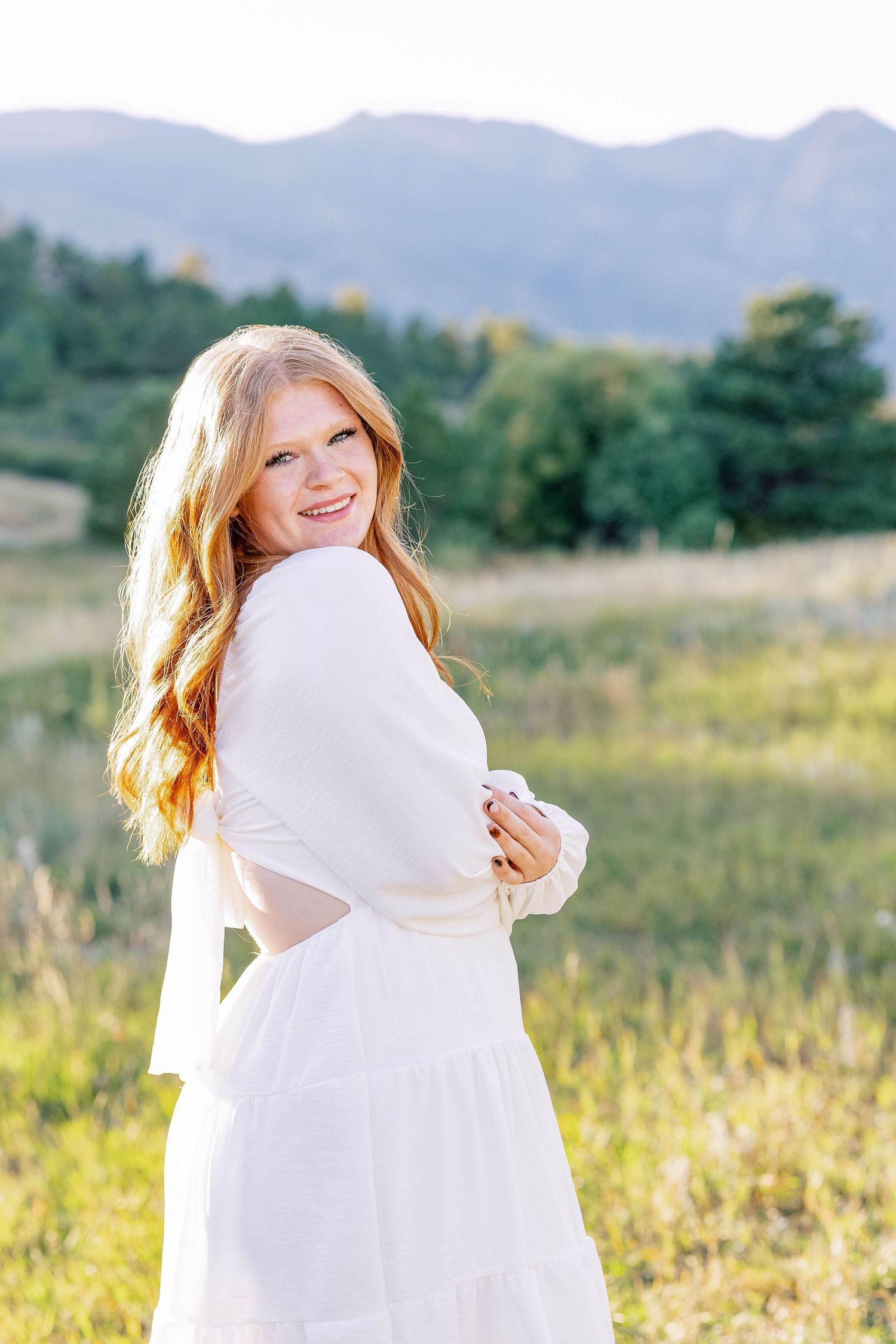 Senior portrait photography in Colorado Springs senior girl with pretty backdrop