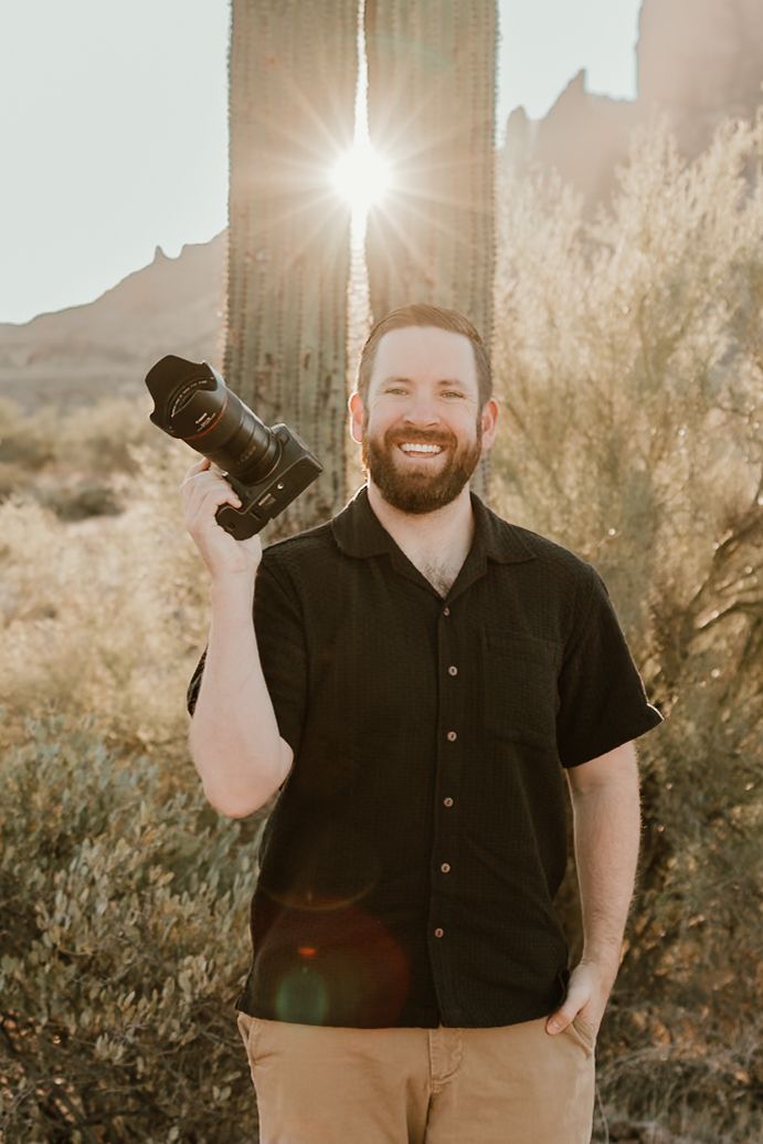 Self portrait in the desert with saguaros in the back just outside of Phoenix Arizona.