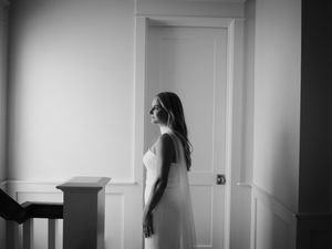 Artistic black and white series showing movement and shadows in an empty hallway.