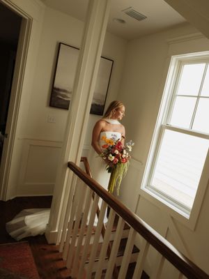 Sequence of wedding photos taken on a staircase with natural window lighting.