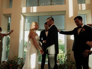 Candid reception photos showing dancing and celebration in a sunlit venue.