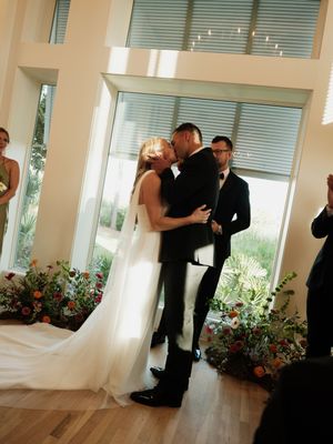 A romantic wedding dance sequence captured indoors with soft lighting.