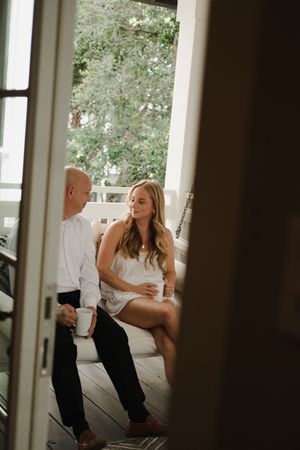 Candid indoor wedding moments captured through window frames.