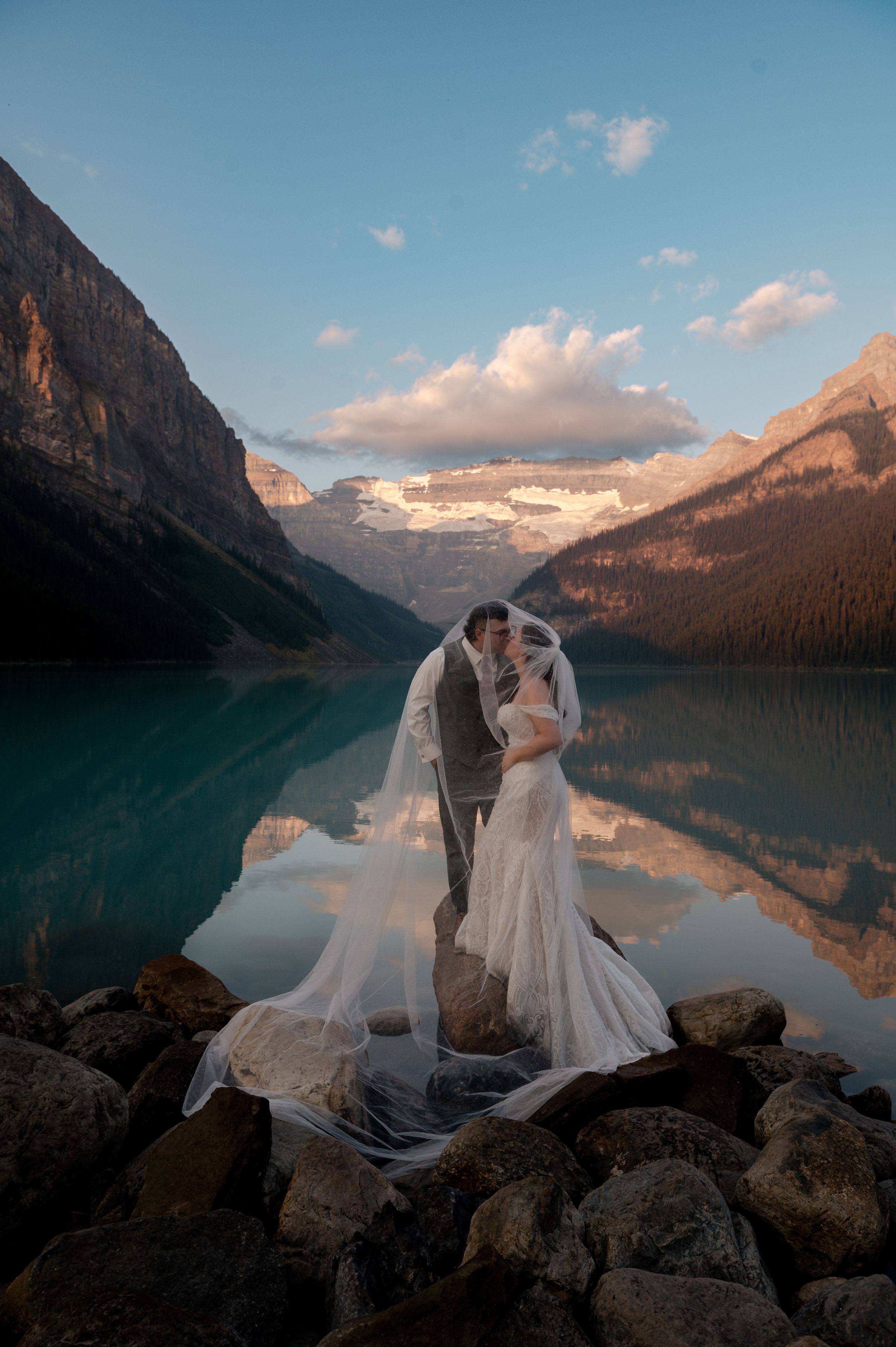 Wedding photography session at Lake Louise with stunning mountain reflections at sunset.