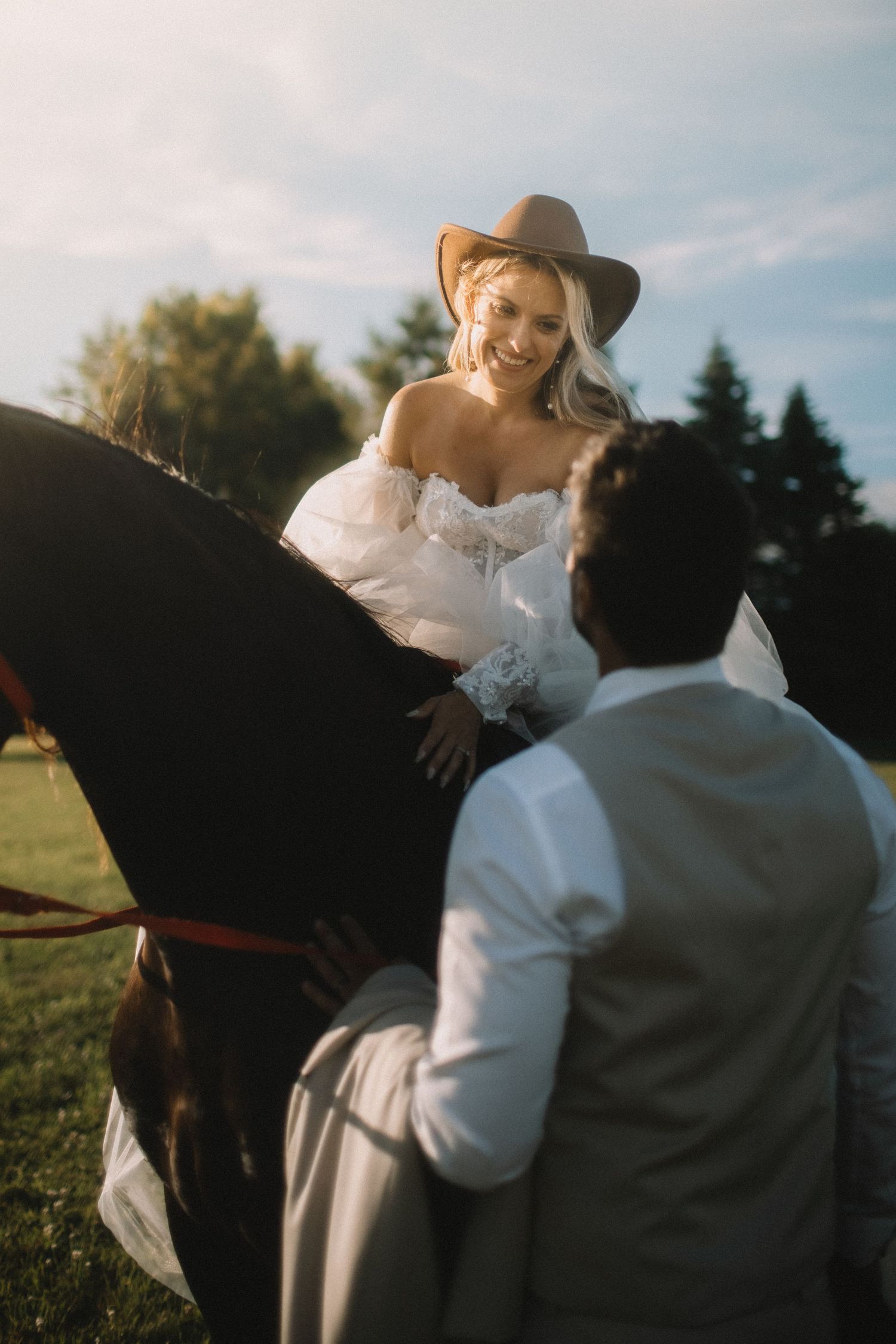 A peaceful moment with a horse in an outdoor setting at sunset.