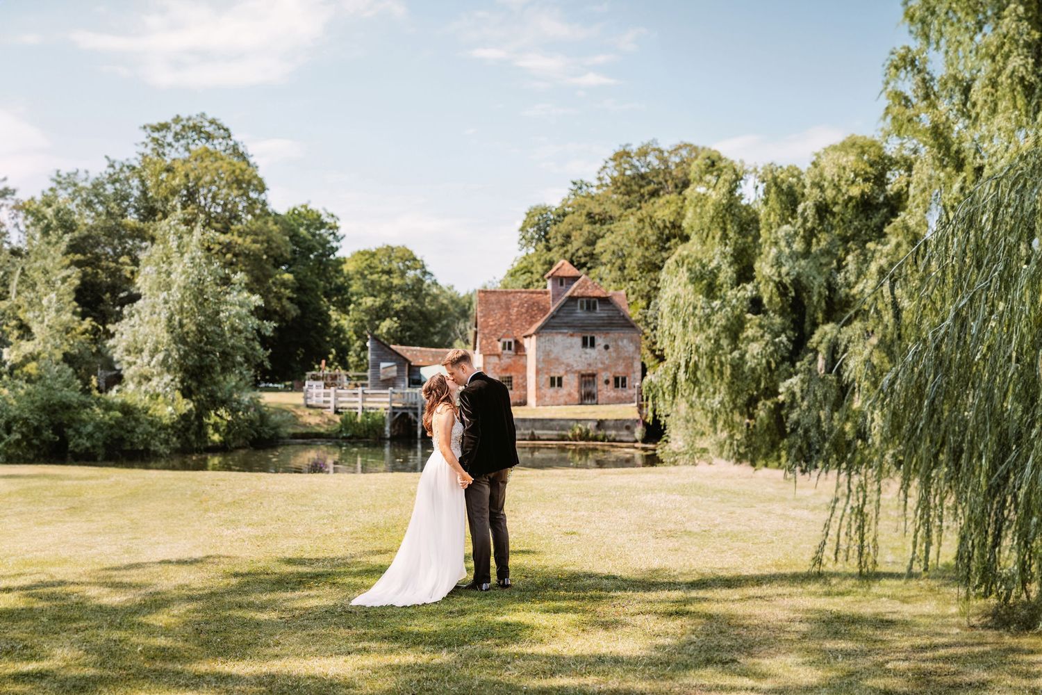 Bride and Groom sharing a kiss in stunning venue captured by professional award winning Oxfordshire wedding photographer Vicky Lewis