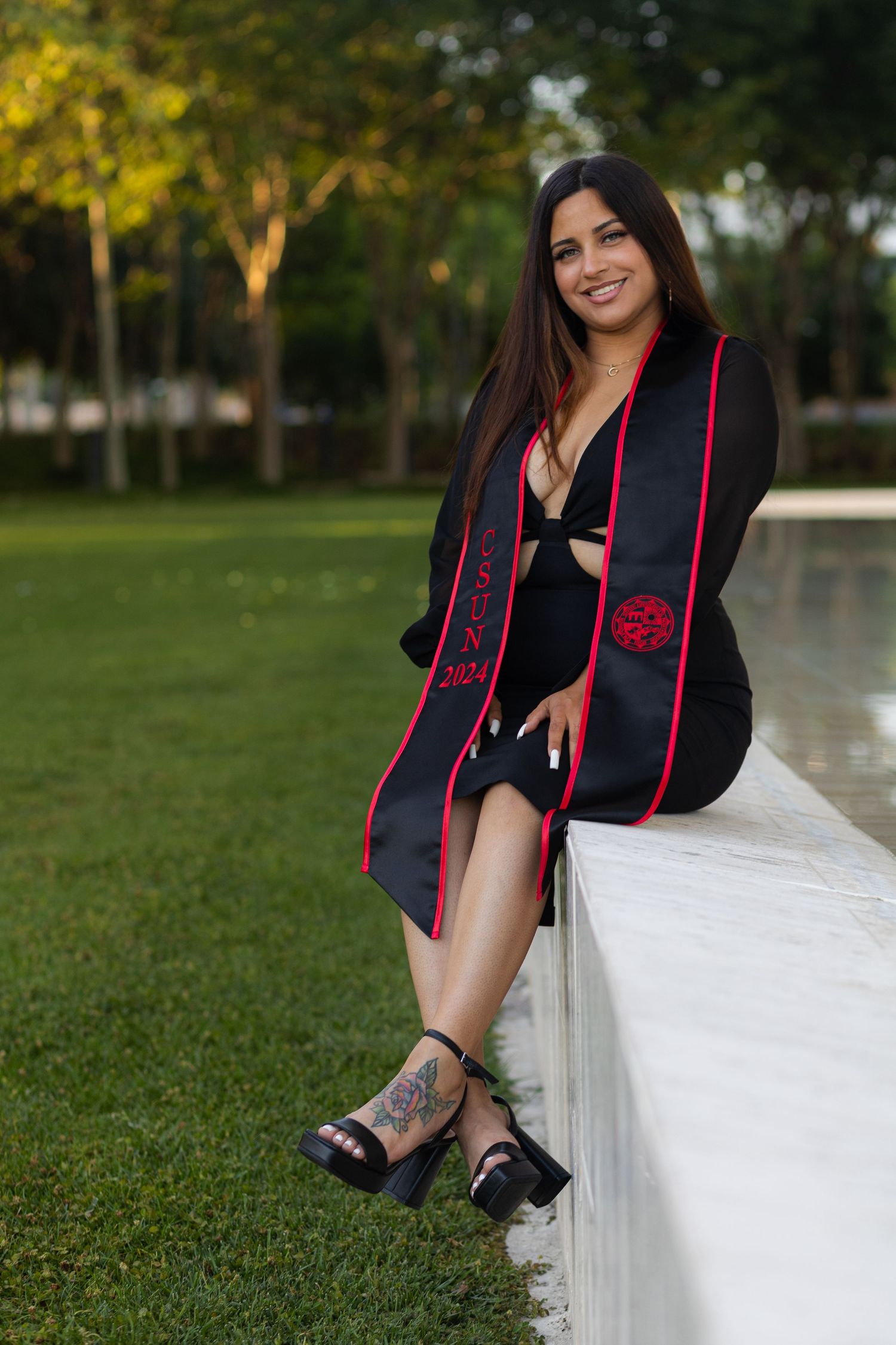 Graduation photoshoot shot at CSUN, California State University of Northridge. Female graduate photographed with style and intent.