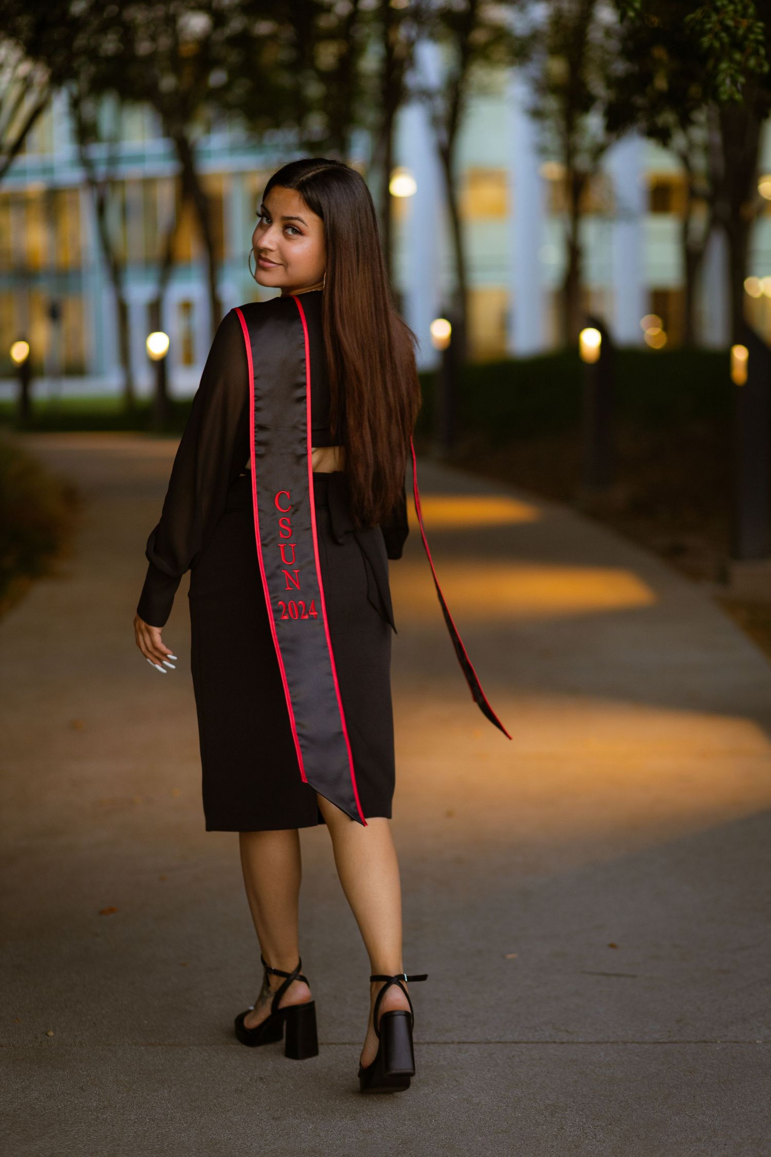 Graduation photoshoot shot at CSUN, California State University of Northridge. Female graduate photographed with style and intent.