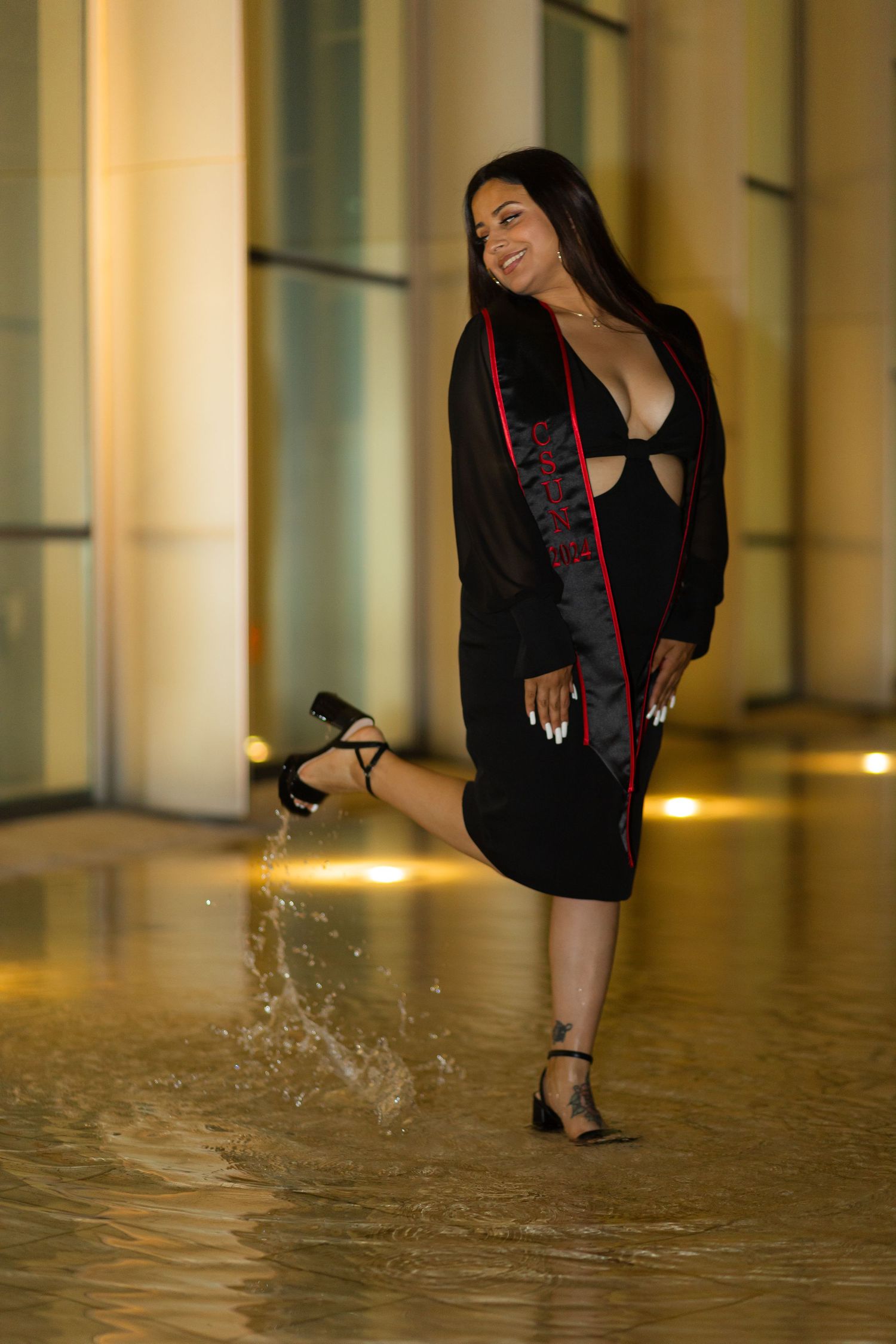 Graduation photoshoot shot at CSUN, California State University of Northridge. Female graduate photographed with style and intent.