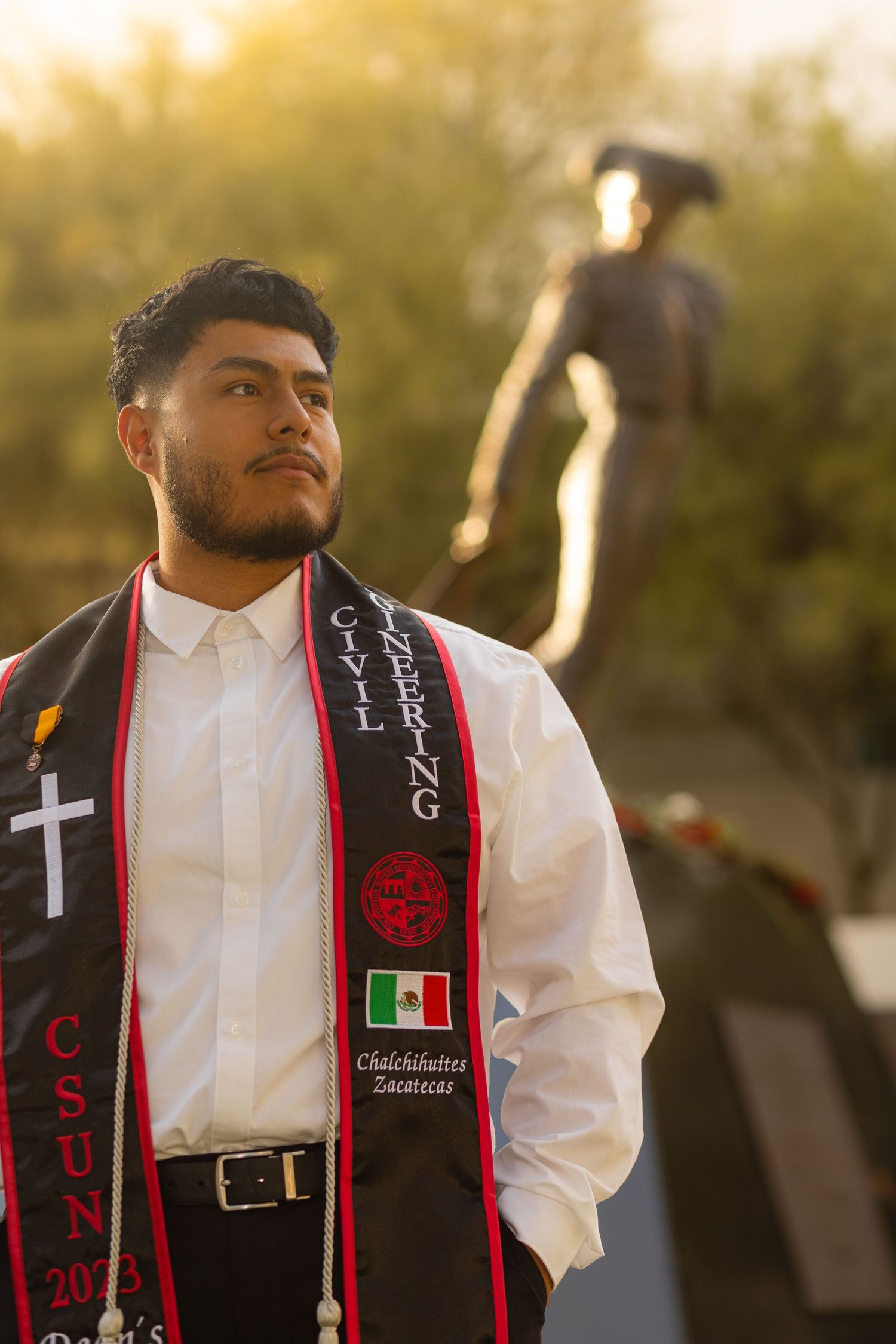 Graduation photoshoot shot at CSUN, California State University of Northridge. Male graduate photographed with style and intent.