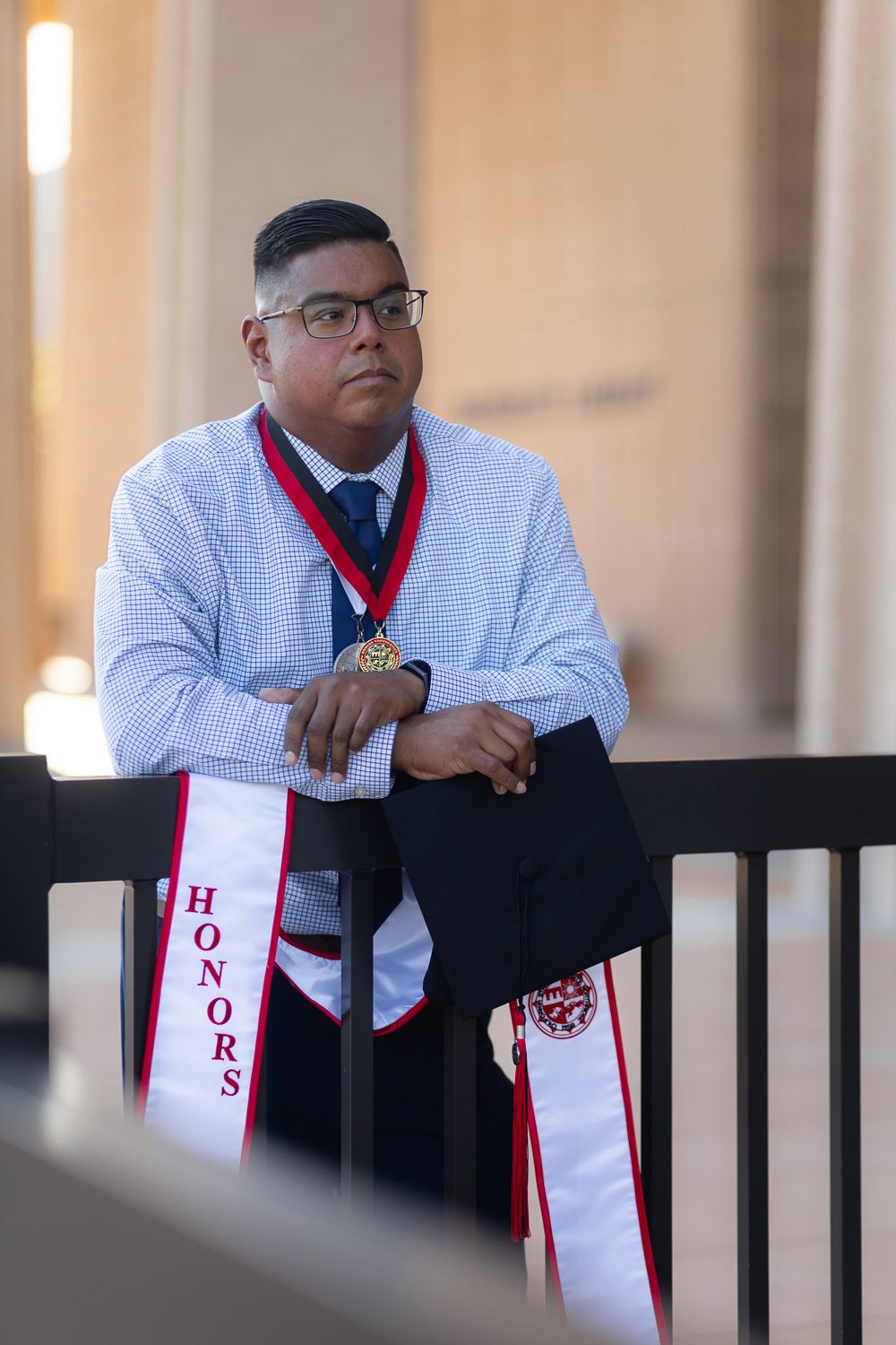 Graduation photoshoot shot at CSUN, California State University of Northridge. Male graduate photographed with style and intent.