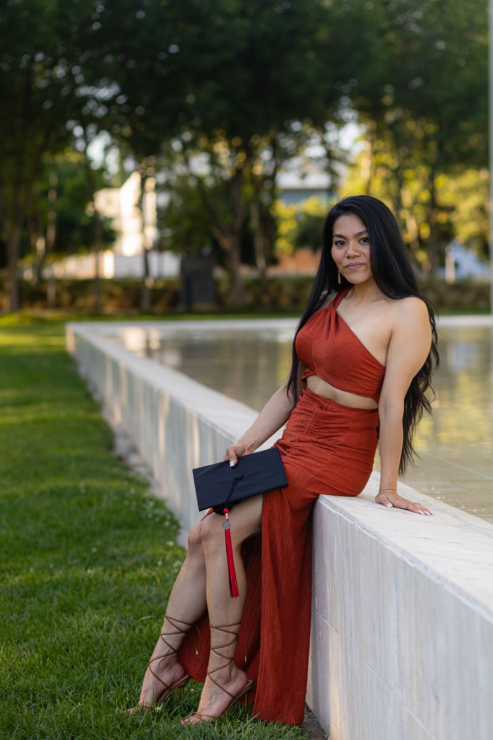 Graduation photoshoot shot at CSUN, California State University of Northridge. Female graduate photographed with style and intent.