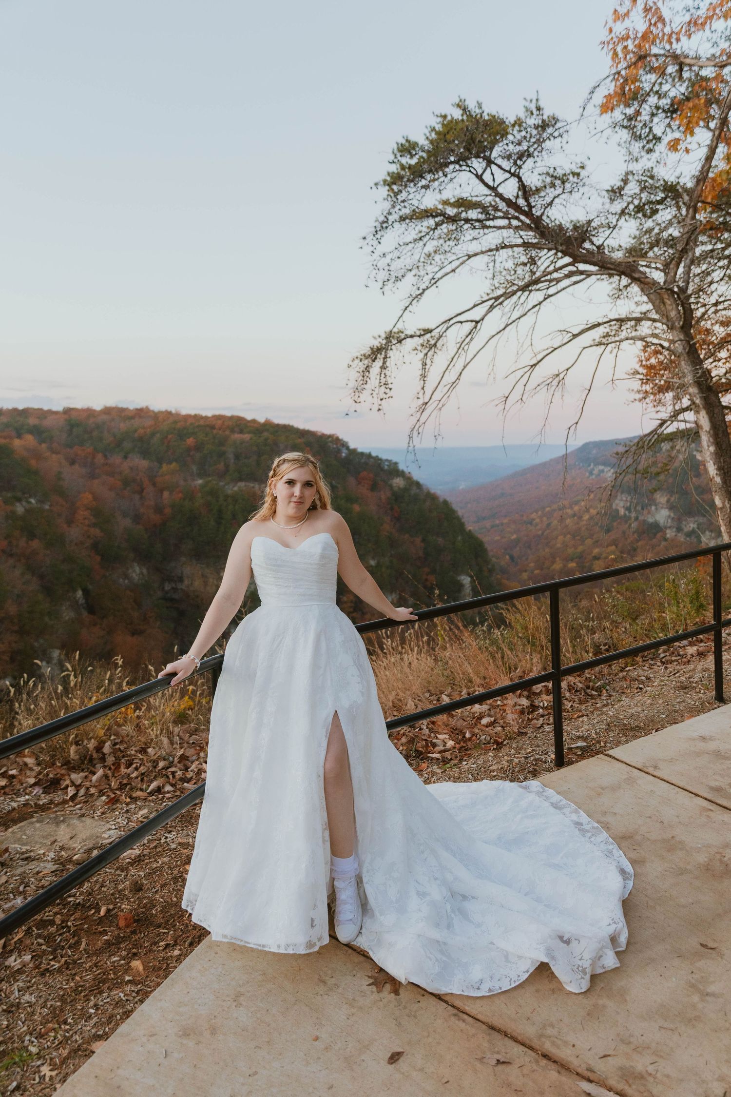 A bridal portrait session on a scenic mountain overlook during autumn.
