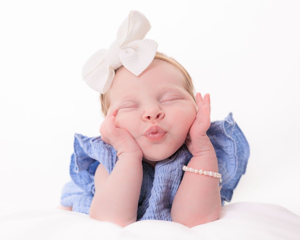Newborn baby sleeping peacefully in a photography session by Swaff Shots.