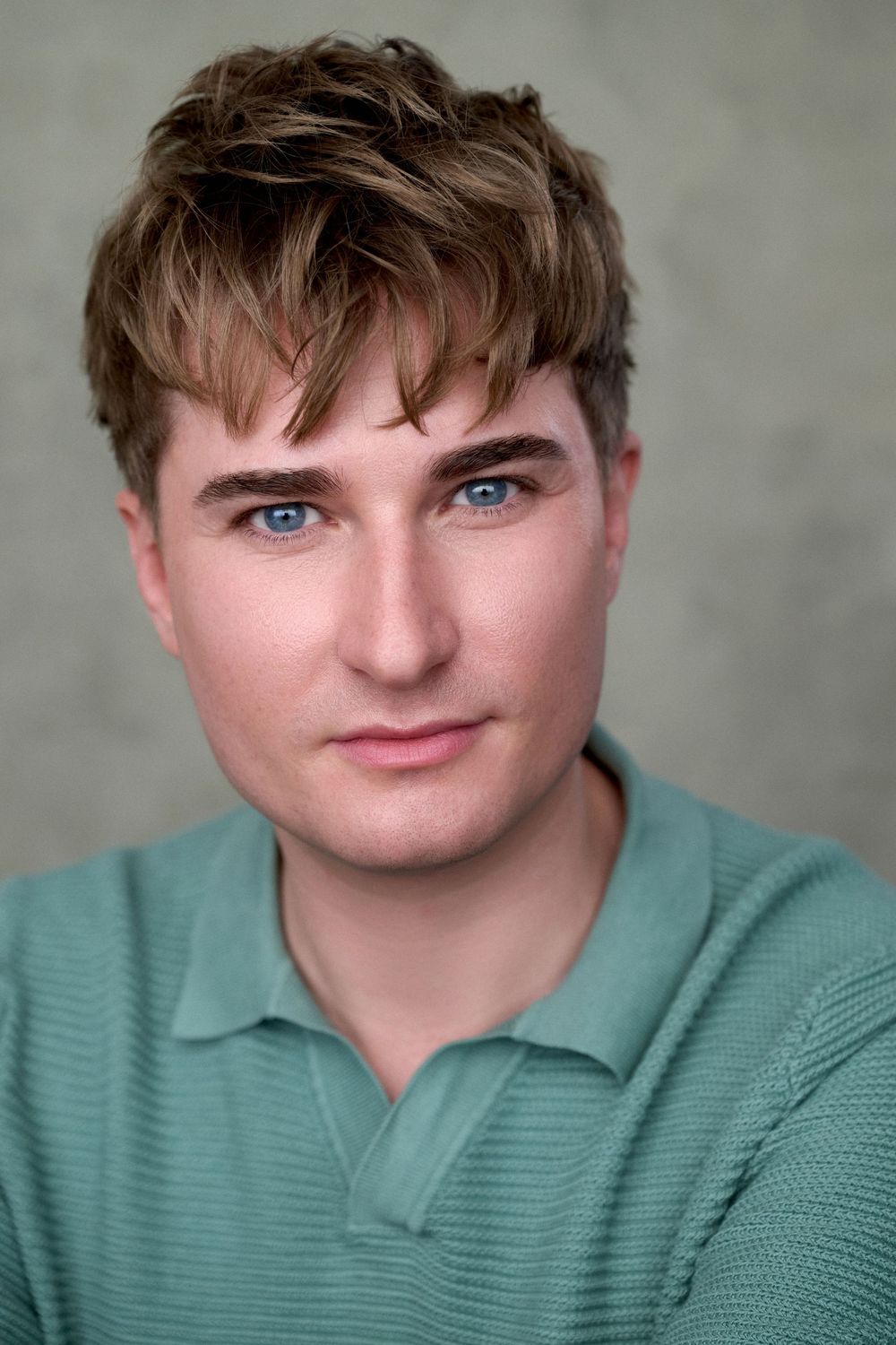 Headshot of performer and agent Thomas Smith shot in the London studio