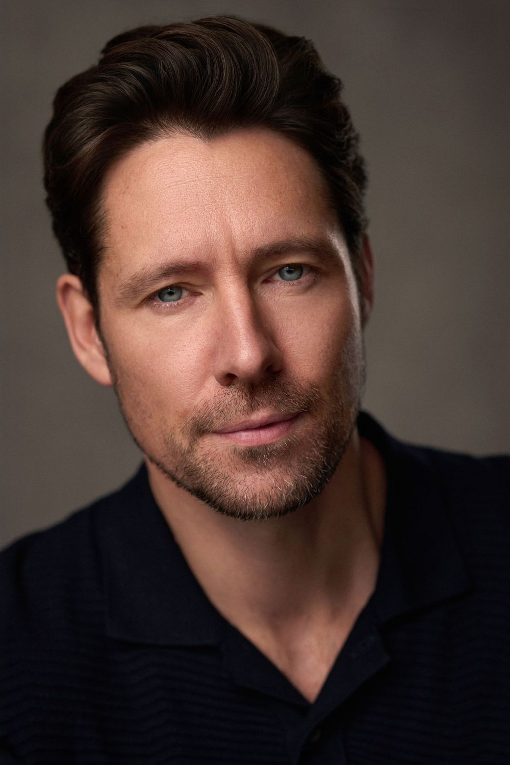 Headshot of actor and model Tom Coulston shot in the London studio