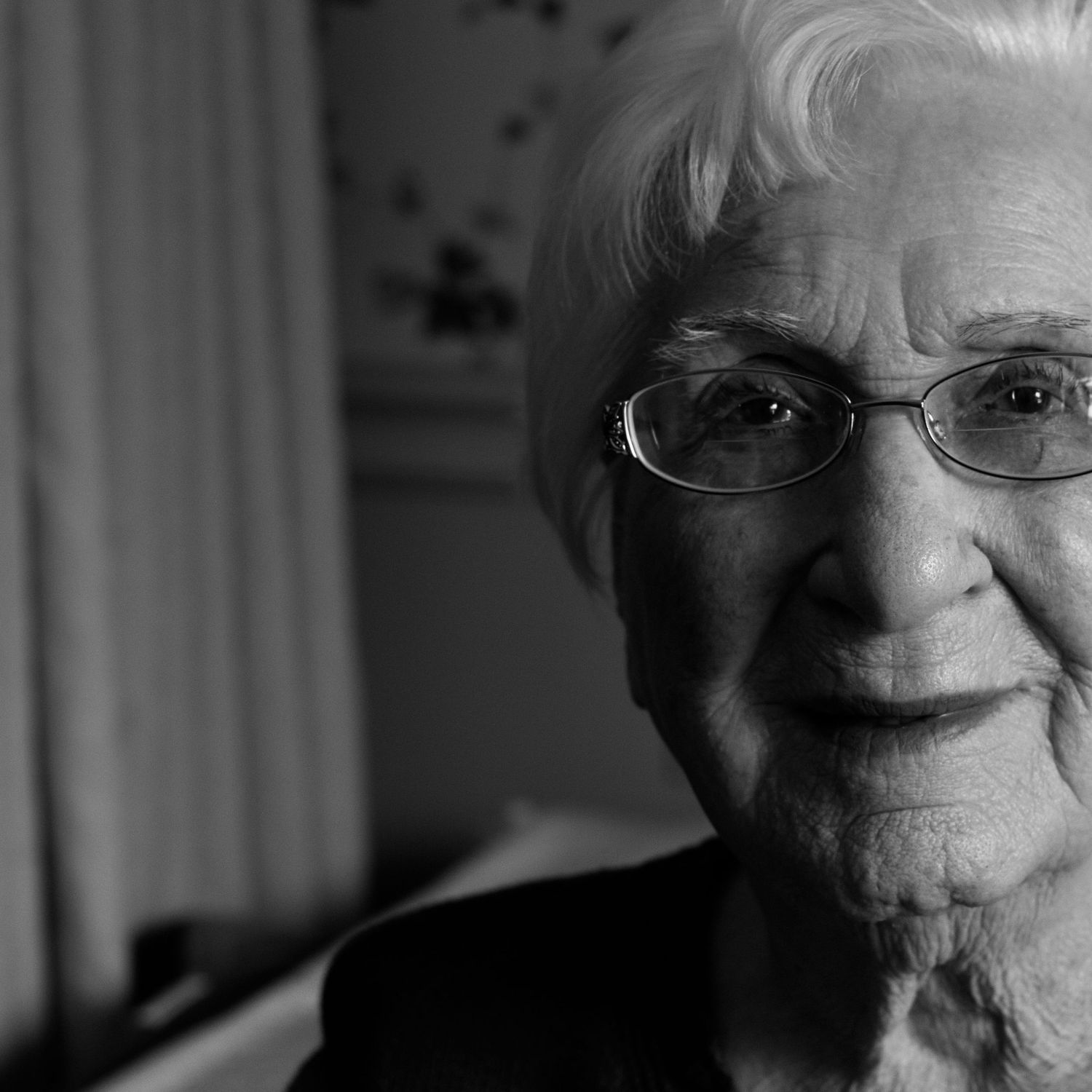 elderly woman smiles at camera