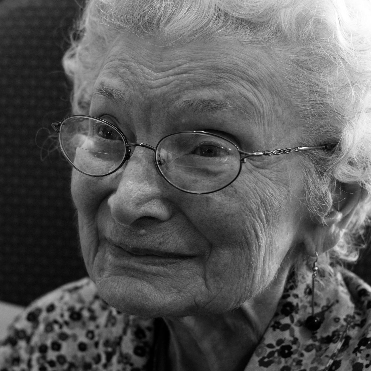 elderly woman smiles at camera