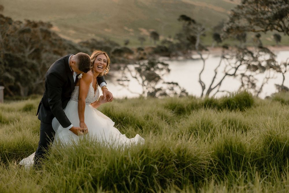 Wedding couple were having fun Sunset wedding shoot at Baylys Farm, Waitangi.  Auckland Photographer