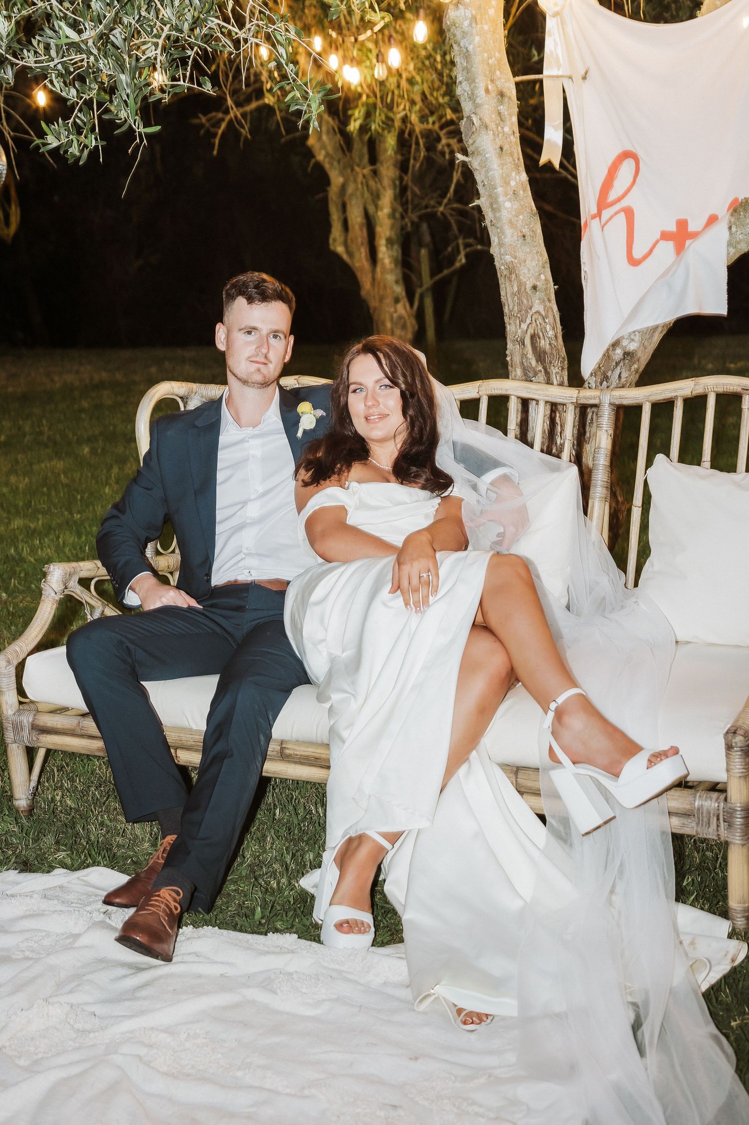Bride and groom sitting during reception at their wedding Kati Kati. Tauranga Photographer