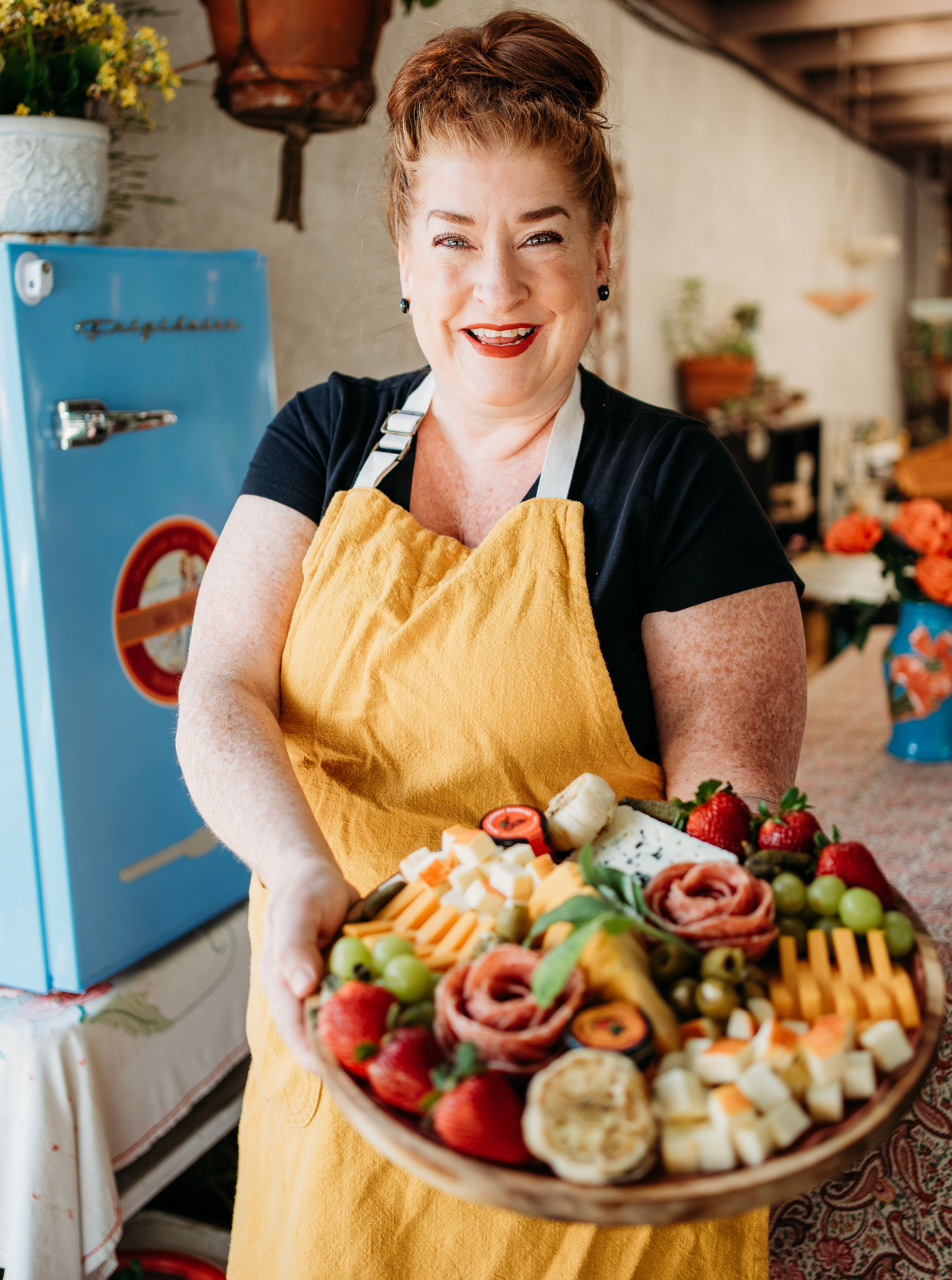 A woman in solano county posing with her product in a headshot for her small business