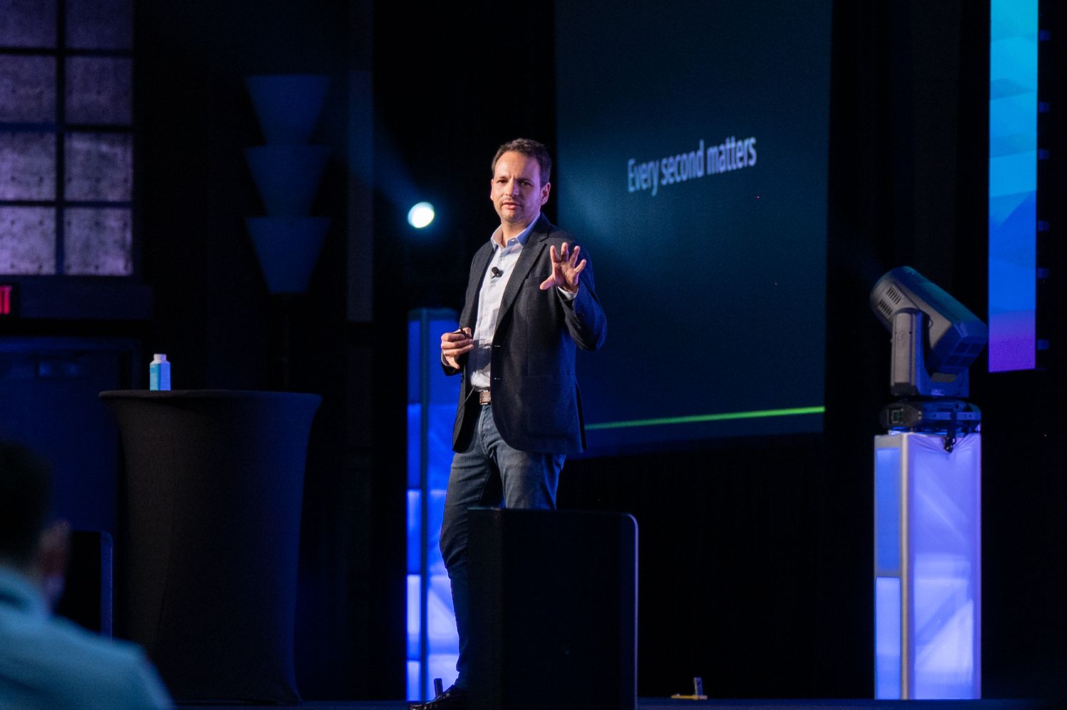A speaker onstage at the Enablon 2024 conference in Houston, TX.