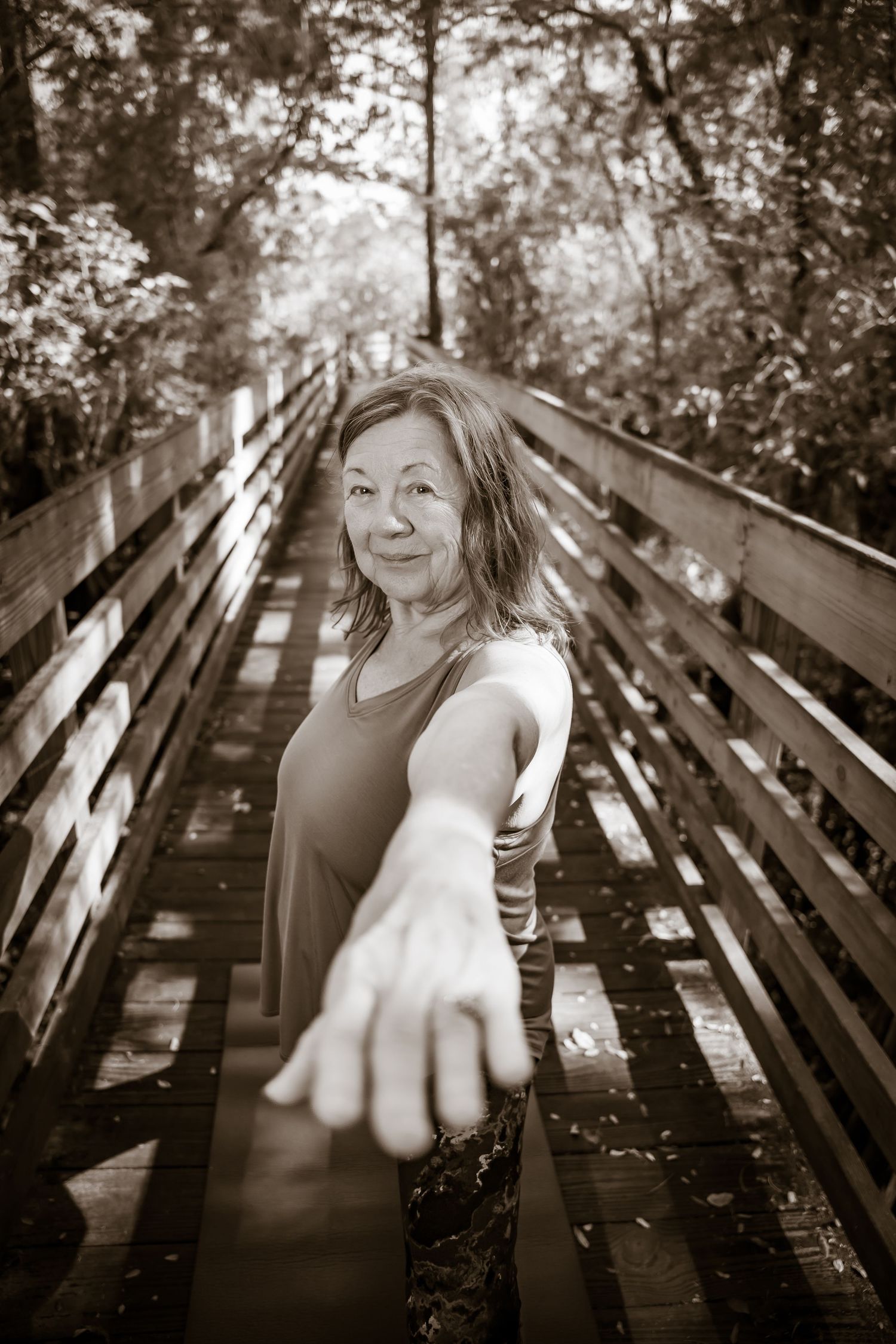 Series of black and white portraits taken on wooden bench in natural lighting.