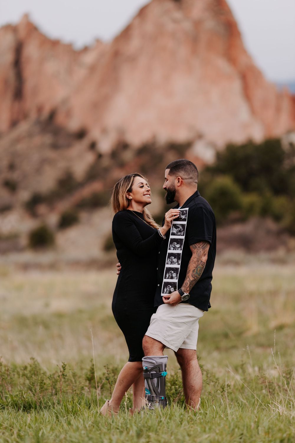 couple in front of garden of the gods with ultrasound images