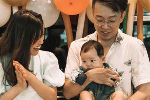 A joyful family moment with balloons and celebrations.