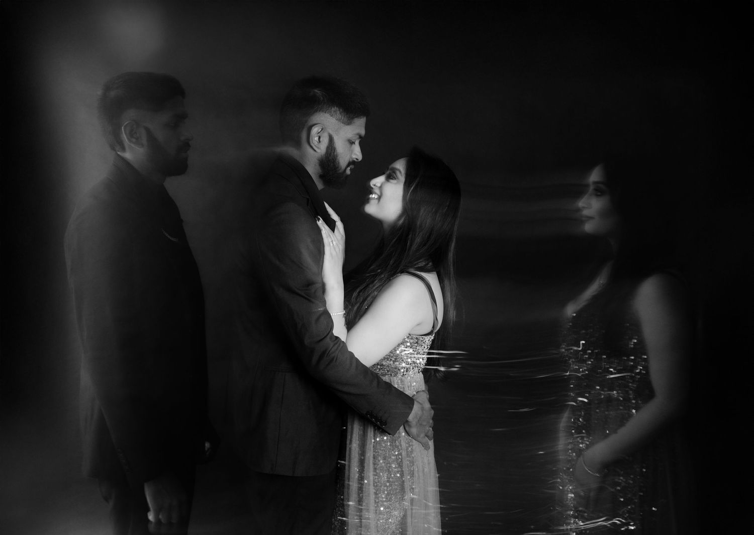 An artistic black and white photo capturing an intimate dance moment.