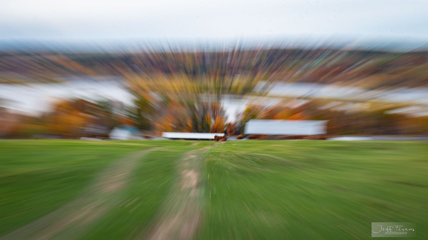 Creative zoom effect picture of a pasture field in the fall.