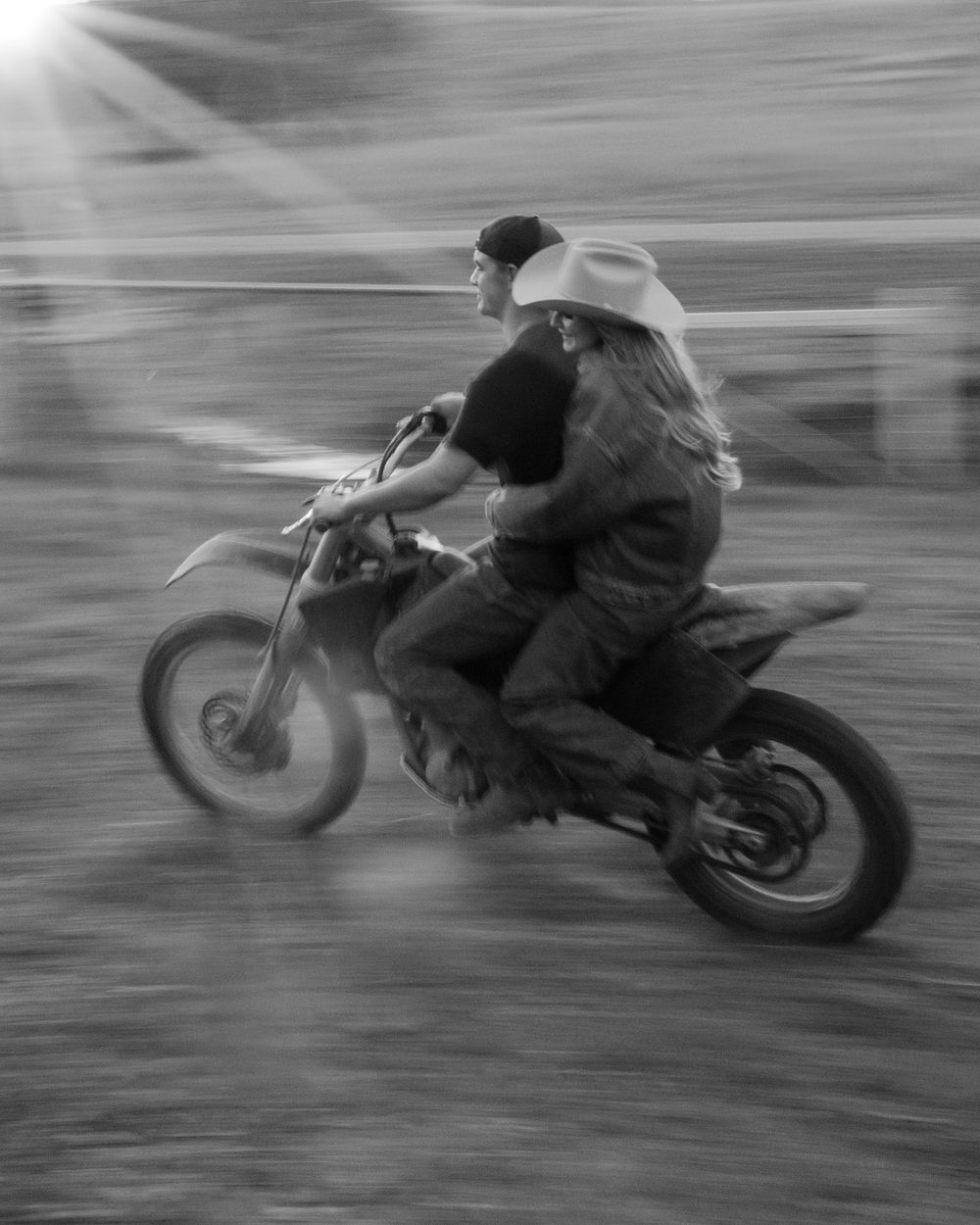 Motion-blurred sequence captures a motorcycle rider speeding across the frame.