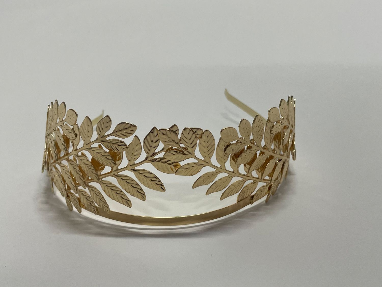 Gold leaf tiara with elegant laurel wreath design and antique metallic finish.