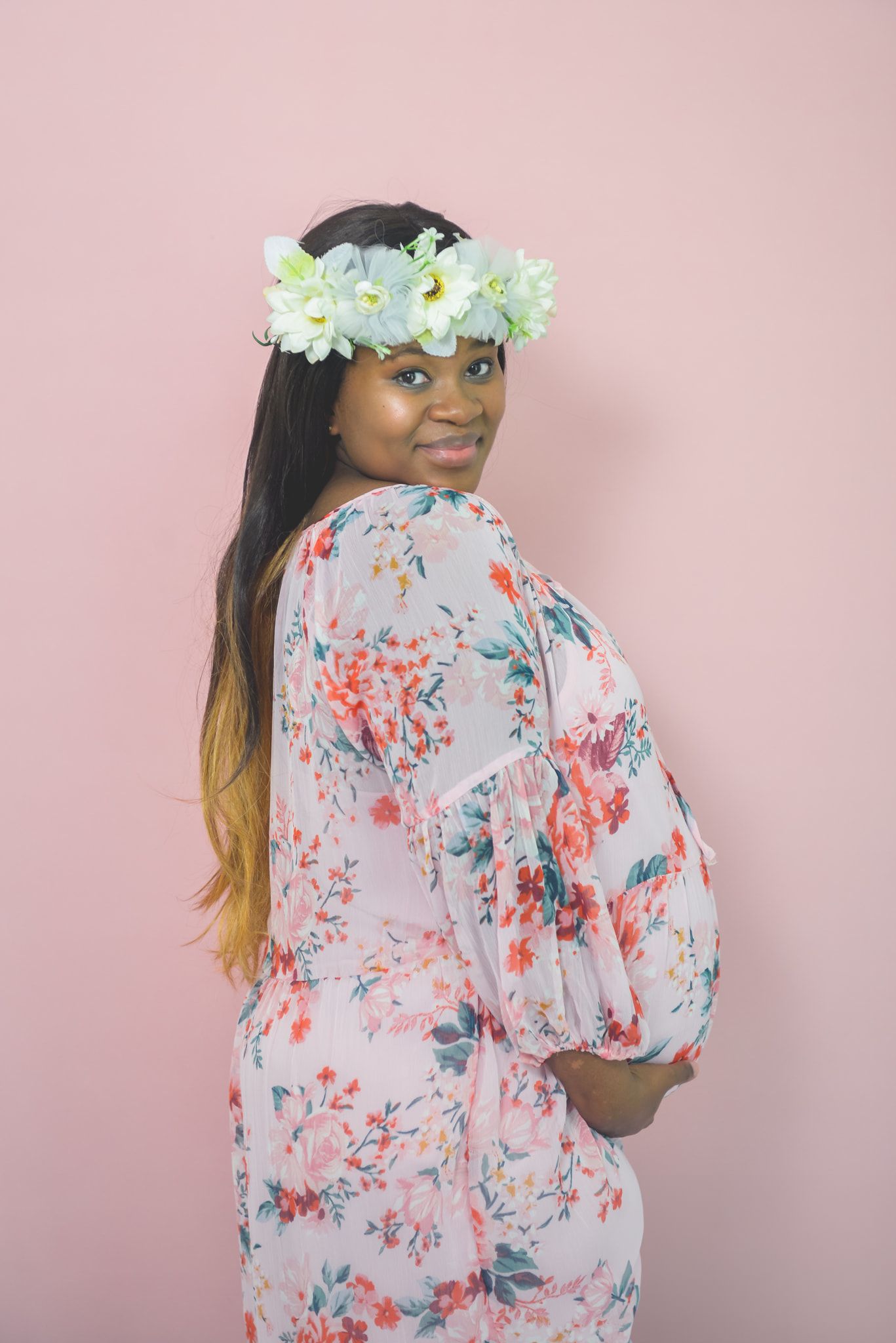 maternity pregnancy photography with beautiful simple pink background
