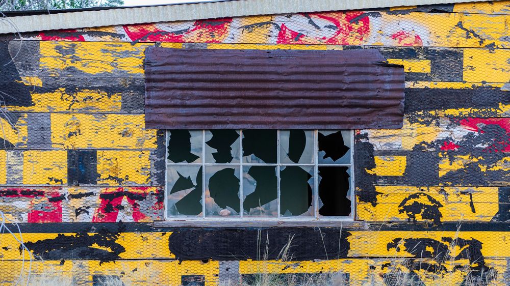 old colourful outside wall with a window
