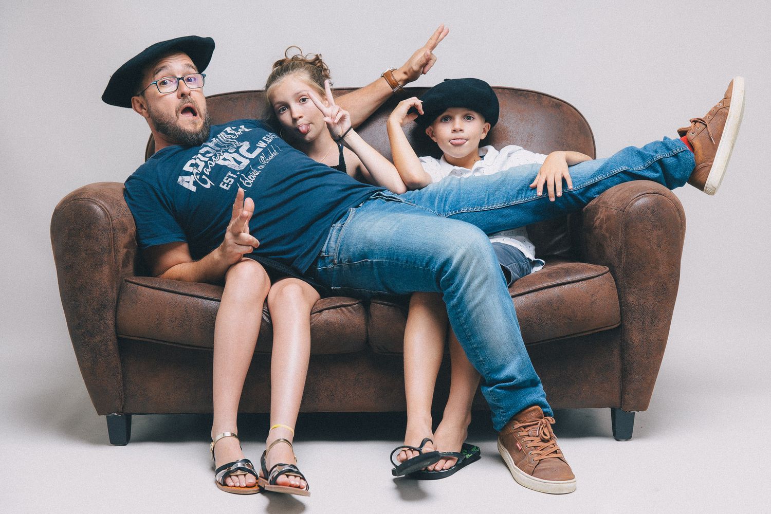 Family photo sequence showing playful poses on a brown leather couch.
