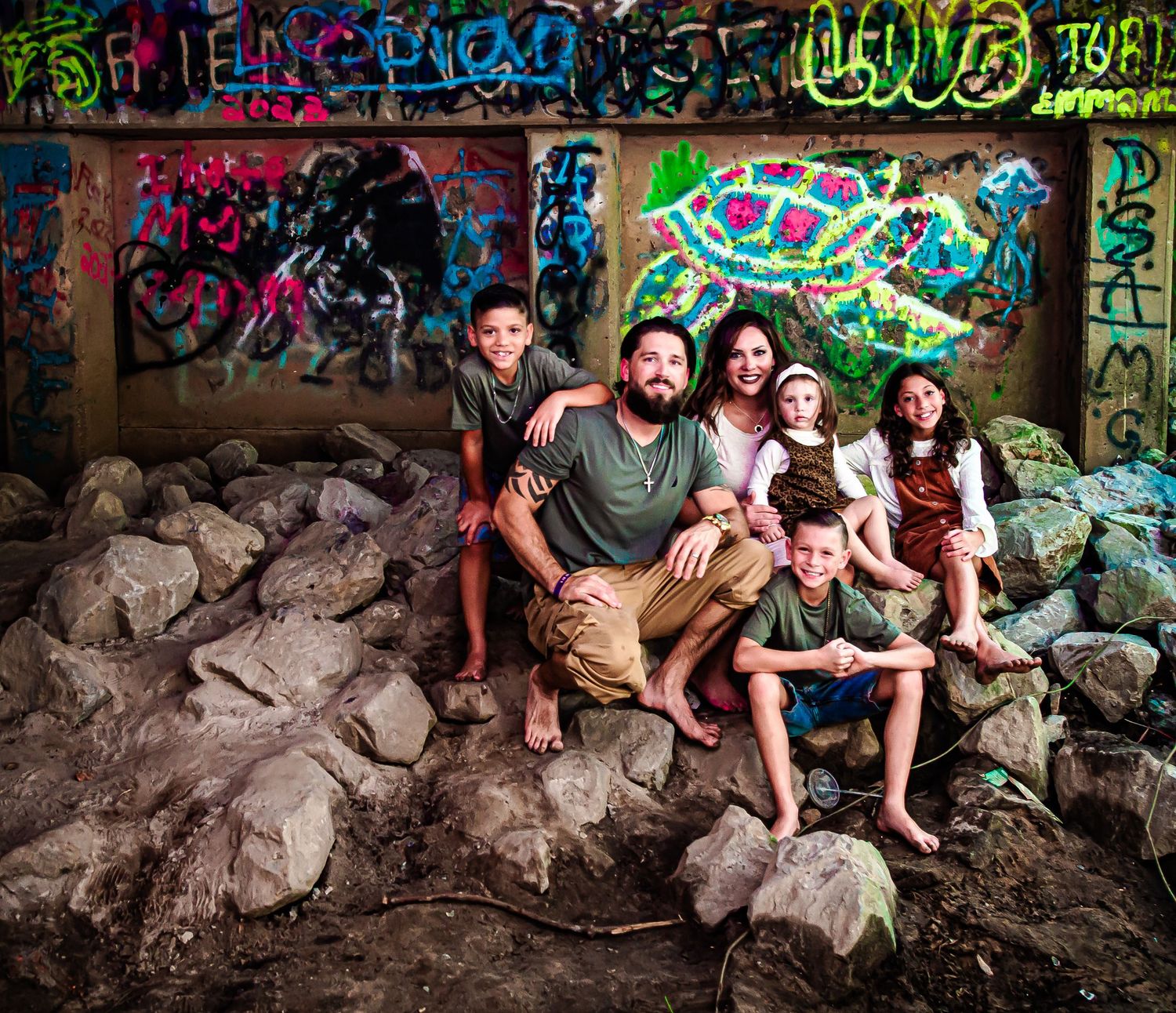 family of 6 session under the bridge creative pose captured Fairhope Alabama