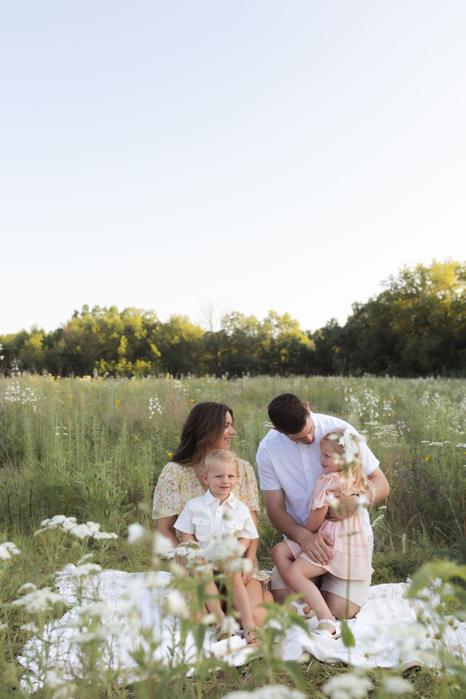 Family photos in a field of wildflowers in Columbia Missouri photographer