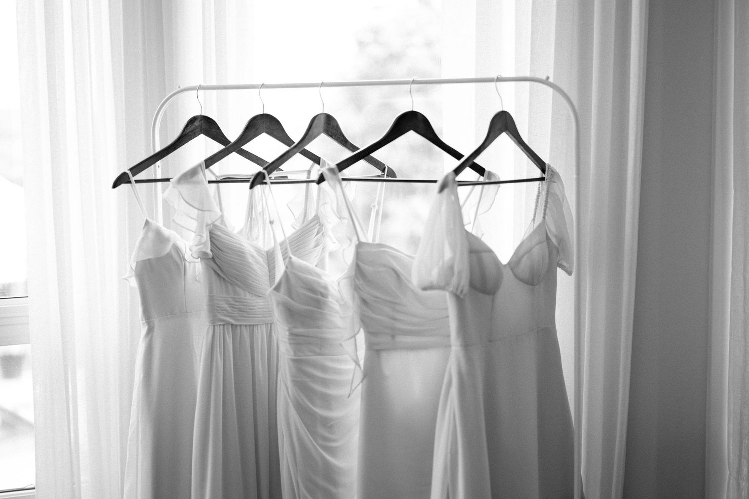Modern bride in a minimalist gown with geometric backdrop for her Okanagan wedding portraits.