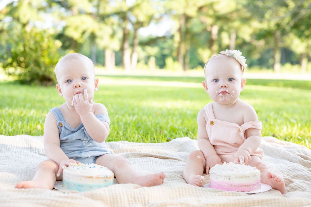 Boy girl twin cake smash photos for 1st birthday twin photoshoot in Clayton, NC.