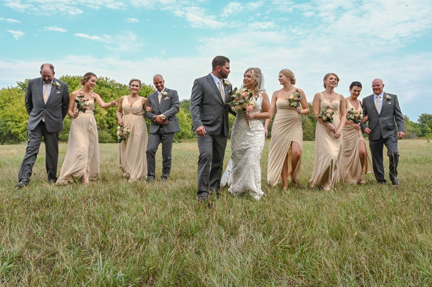 Photograph of wedding party in a field