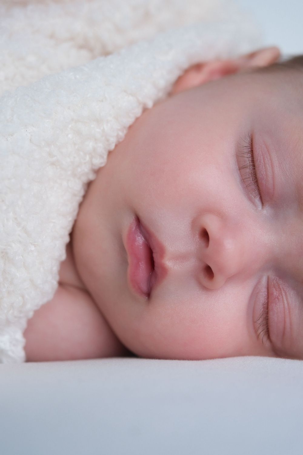 close up macro shot of newborn baby girl face