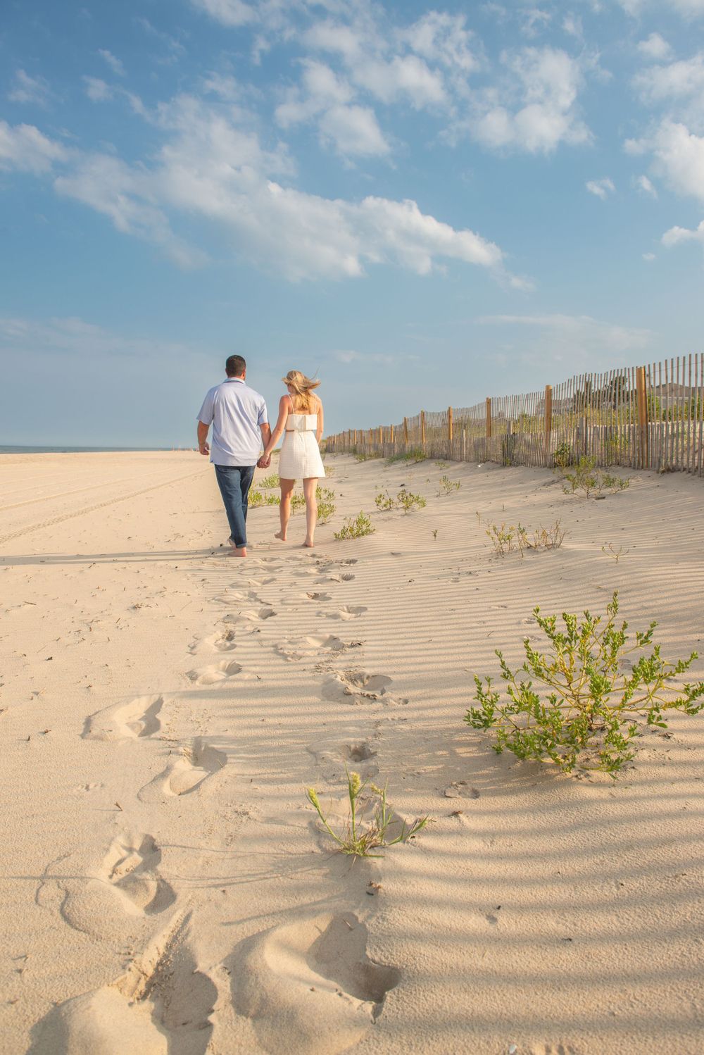 couples portraits on the beach in dewey beach, DE